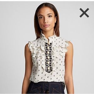 Silk top. Add some elastic to prevent buttons to open by a professional tailor!